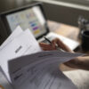 Job searcher looking through a resume